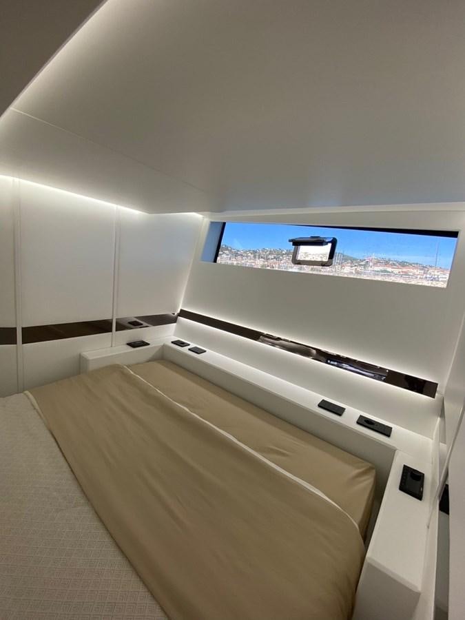 a view of a room with a tv on the wall aboard SUERT 70 Yacht for Sale