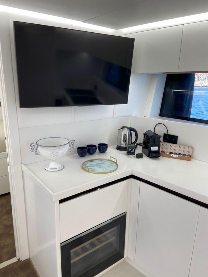 a kitchen with a microwave oven and a toaster on a counter aboard SUERT 70 Yacht for Sale