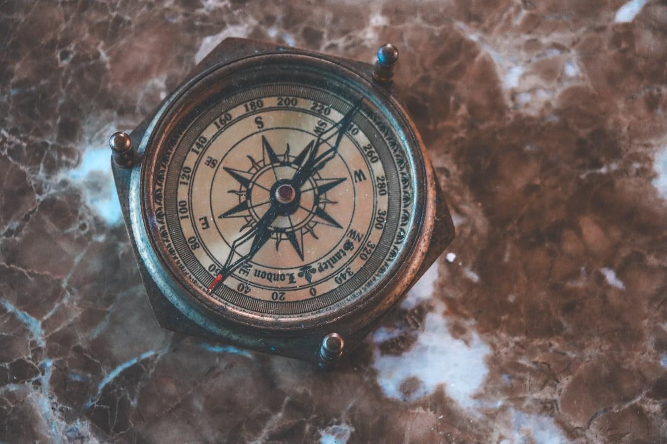 a compass on a rock aboard ROYAL ROCKSTAR Yacht for Sale