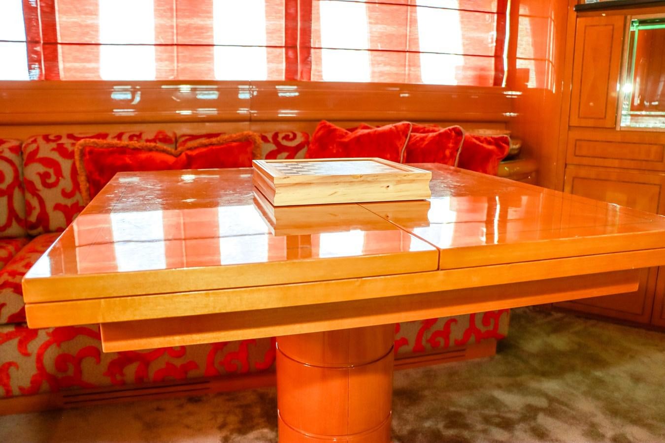 a table with books on it aboard ROYAL ROCKSTAR Yacht for Sale