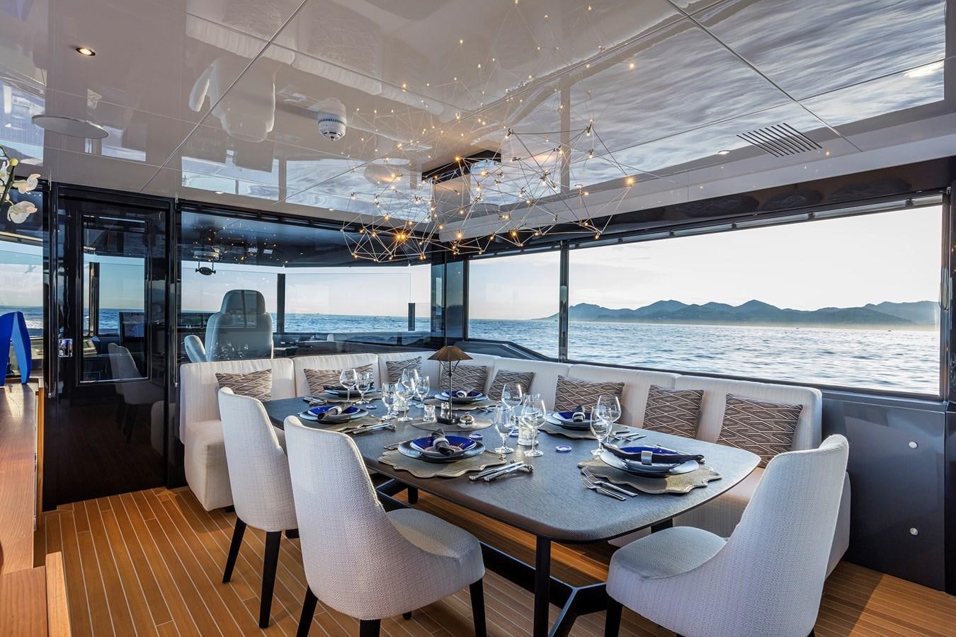 a dining table on a deck aboard SEA CORAL II Yacht for Sale