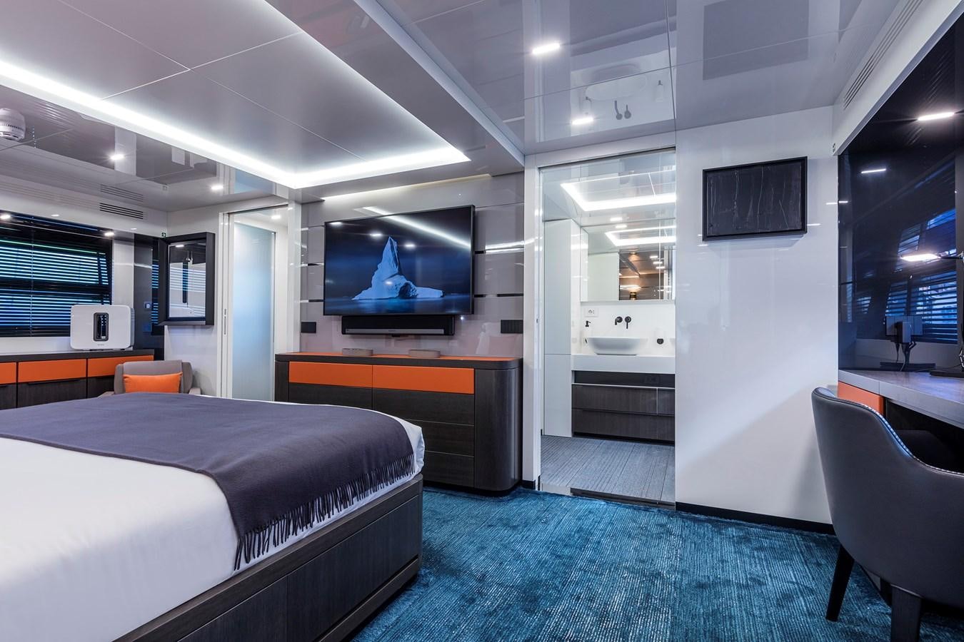 a room with a bed and a tv aboard SEA CORAL II Yacht for Sale