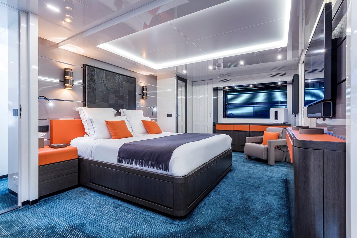 a large bedroom with a large bed aboard SEA CORAL II Yacht for Sale