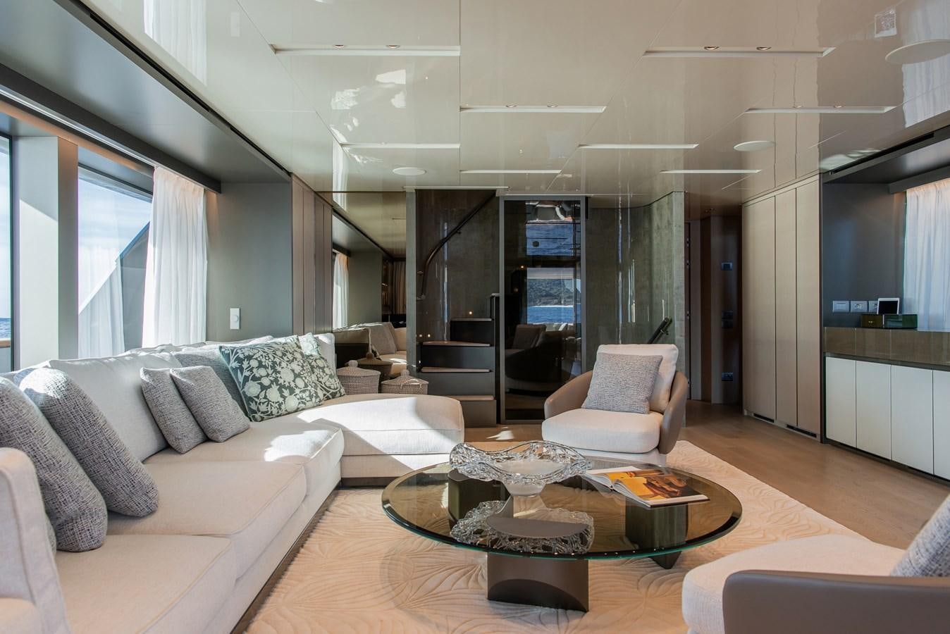 a living room with a large glass door aboard STONE HILLS Yacht for Sale