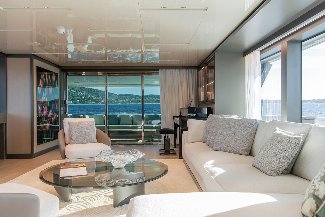 a living room with a large glass window aboard STONE HILLS Yacht for Sale