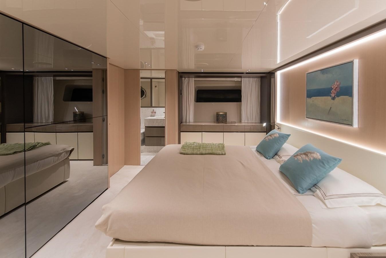 a large bedroom with a bed aboard STONE HILLS Yacht for Sale