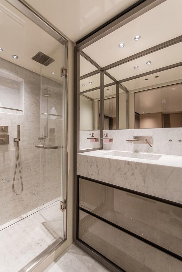 a bathroom with a glass shower aboard STONE HILLS Yacht for Sale
