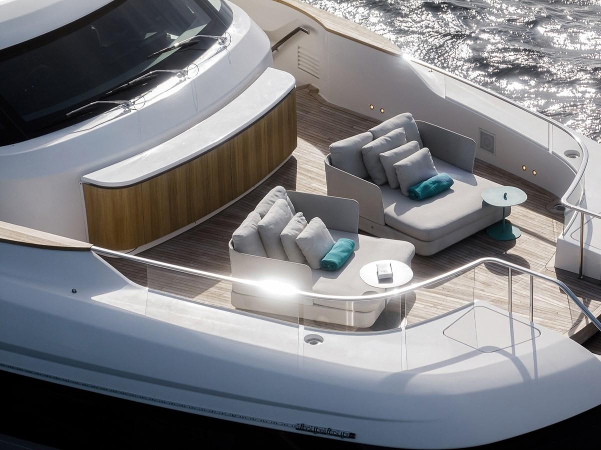a boat with a couch and a chair on it aboard STONE HILLS Yacht for Sale