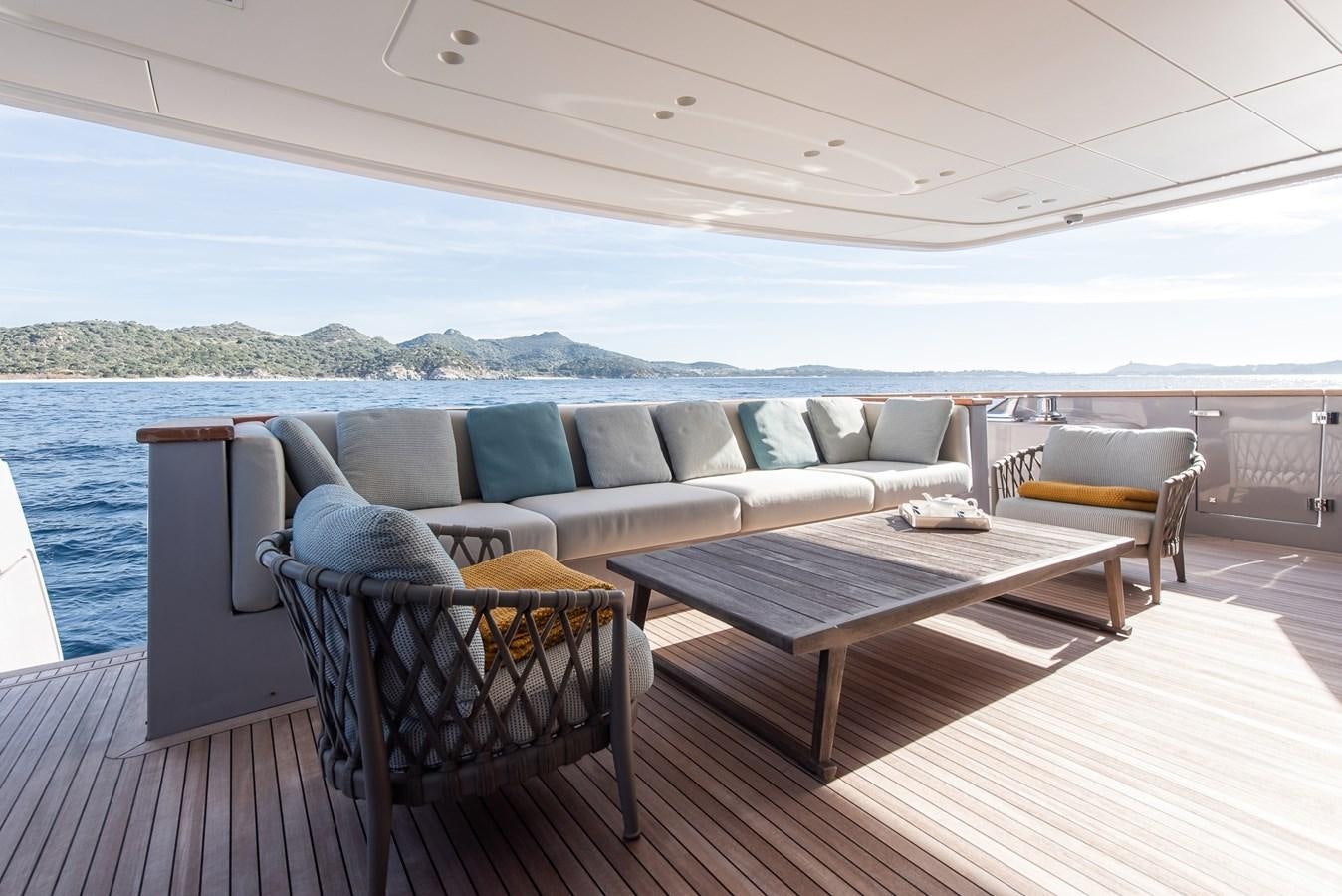 a couch and chairs on a deck aboard STONE HILLS Yacht for Sale