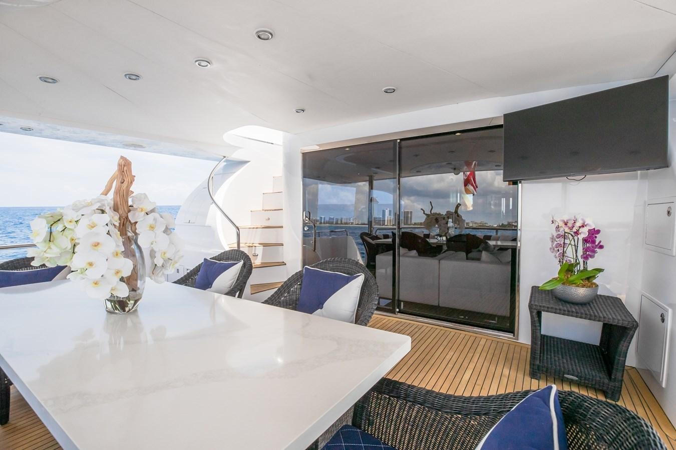 a room with a table and chairs aboard BAD DADDY Yacht for Sale