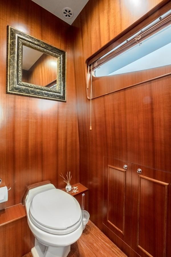 a bathroom with wooden walls aboard BAD DADDY Yacht for Sale