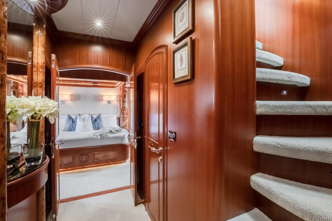 a room with a bed and a mirror aboard BAD DADDY Yacht for Sale