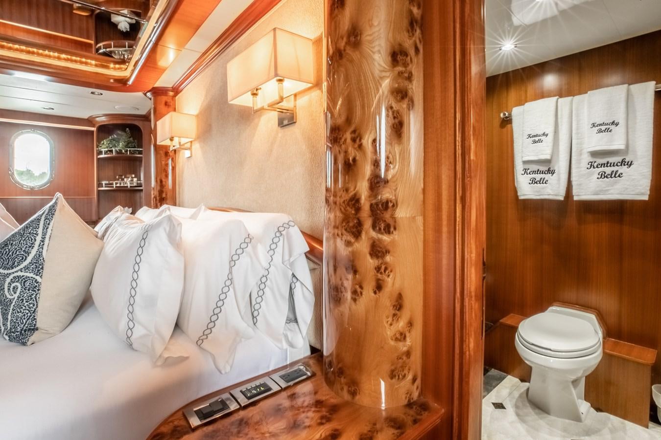 a bathroom with a toilet and a shower curtain aboard BAD DADDY Yacht for Sale