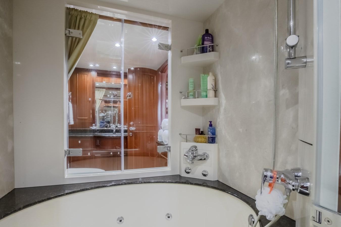 a bathroom with a large mirror aboard BAD DADDY Yacht for Sale
