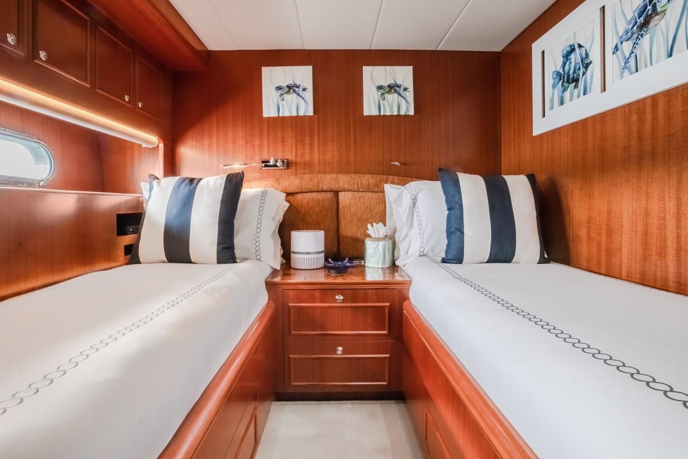 a room with two beds aboard BAD DADDY Yacht for Sale
