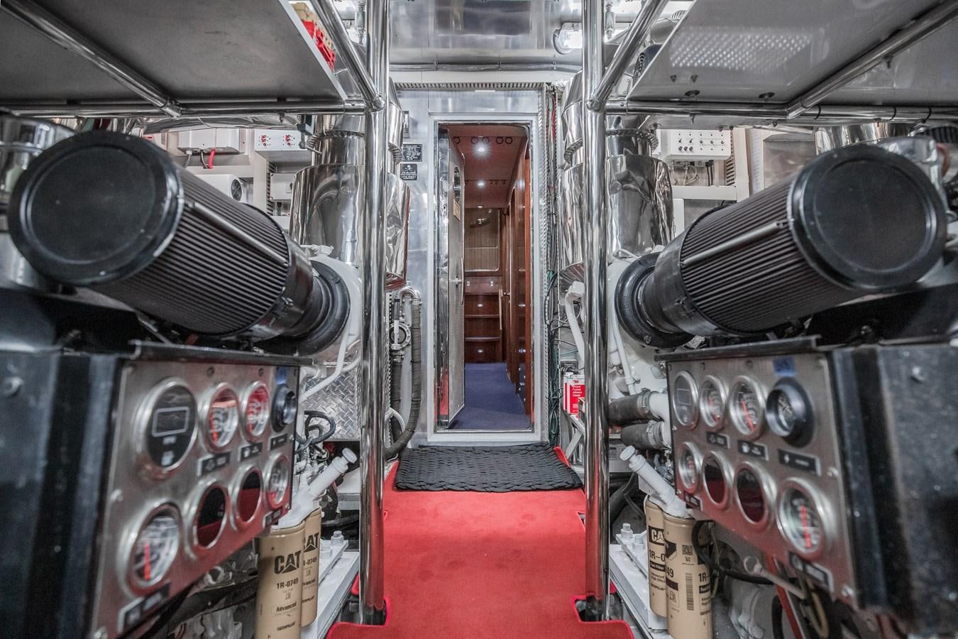 a room with a red carpet and a red carpet aboard BAD DADDY Yacht for Sale