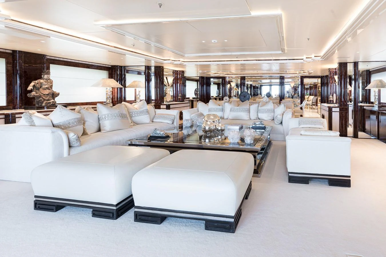 a large living room with white couches aboard LIONESS V Yacht for Sale