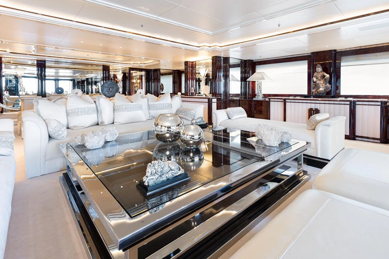 a living room with a large table aboard LIONESS V Yacht for Sale