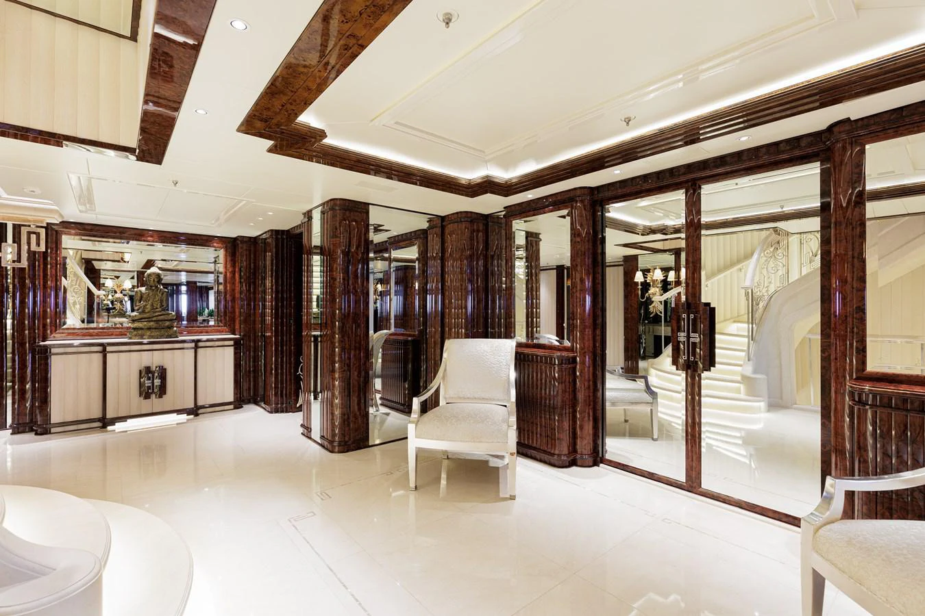 a room with a table chairs and a large glass door aboard LIONESS V Yacht for Sale