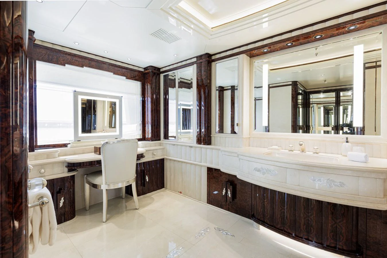 a bathroom with a large bathtub and a chair aboard LIONESS V Yacht for Sale