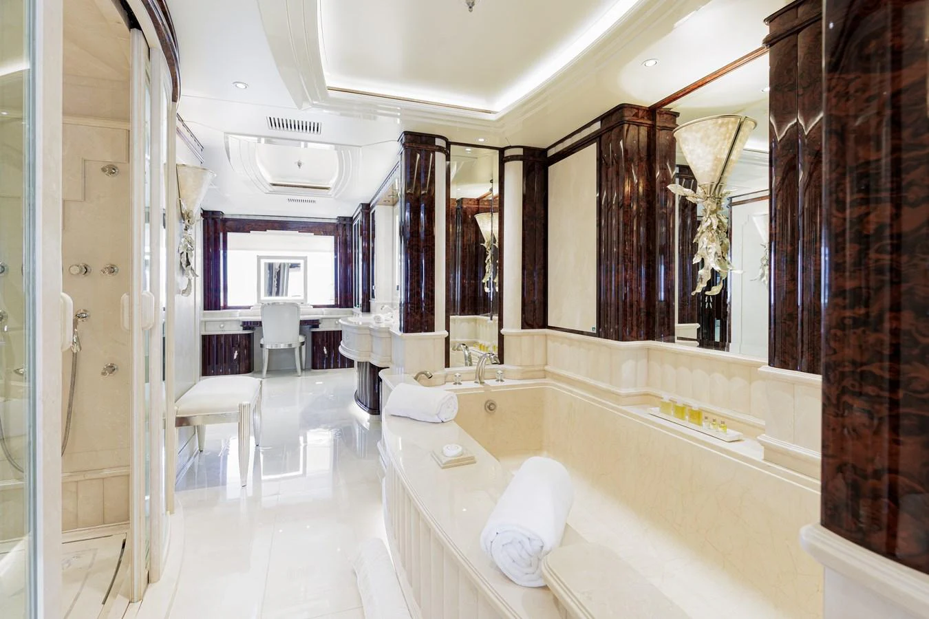 a bathroom with a bathtub and sinks aboard LIONESS V Yacht for Sale