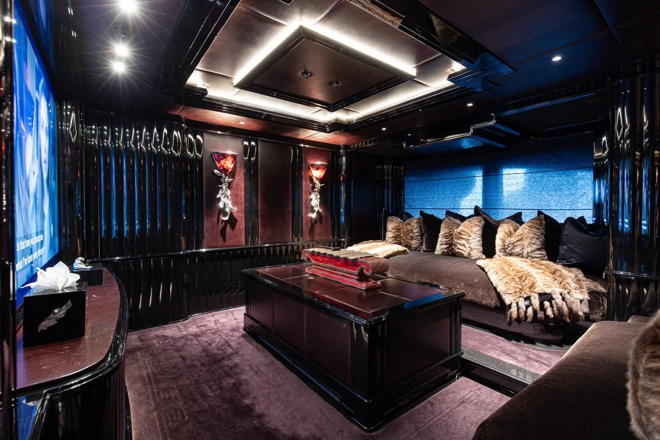 a room with a couch and a table aboard LIONESS V Yacht for Sale