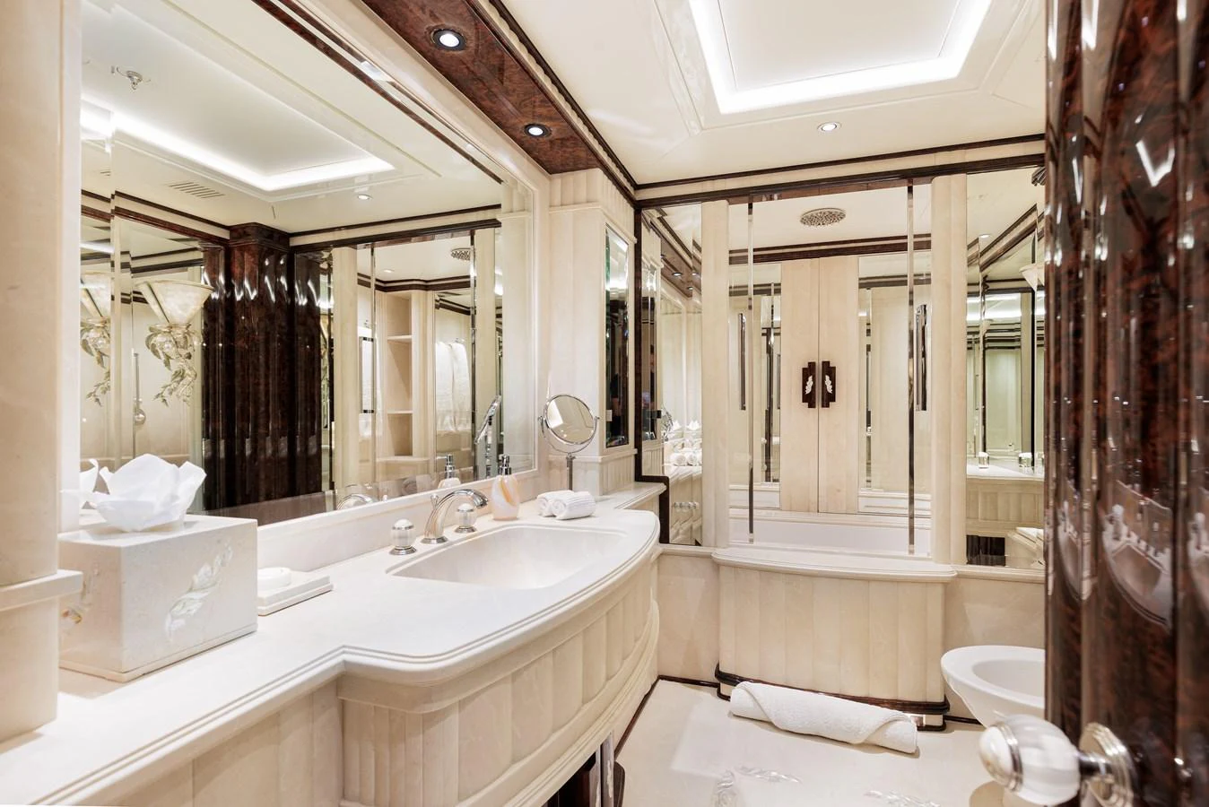 a bathroom with a large mirror aboard LIONESS V Yacht for Sale