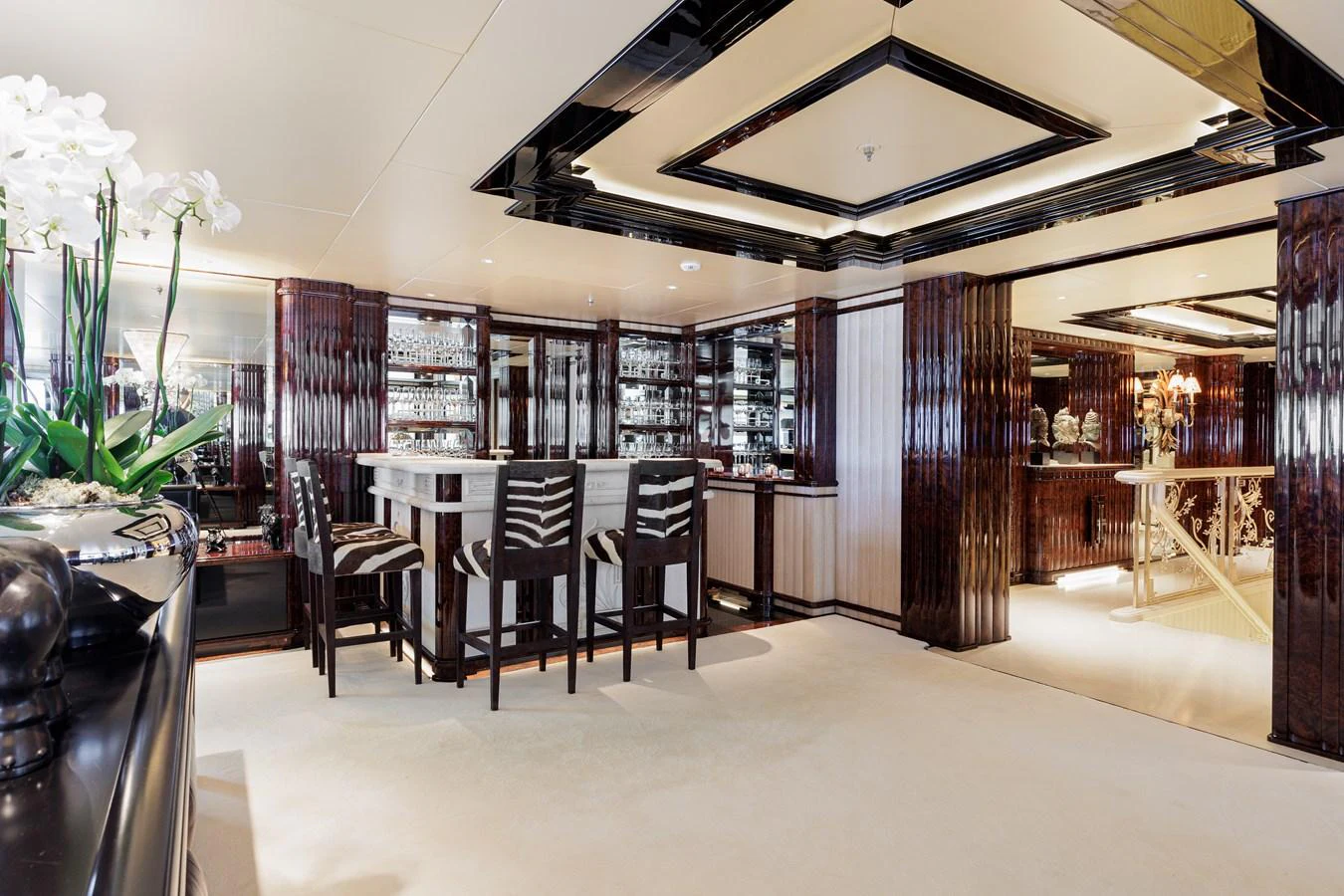 a room with a table chairs and a large window aboard LIONESS V Yacht for Sale