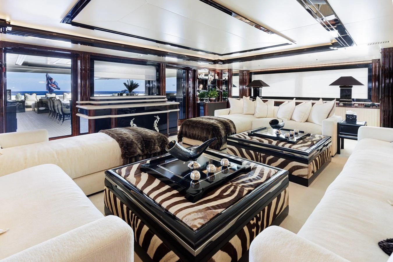 a living room with a large glass window aboard LIONESS V Yacht for Sale