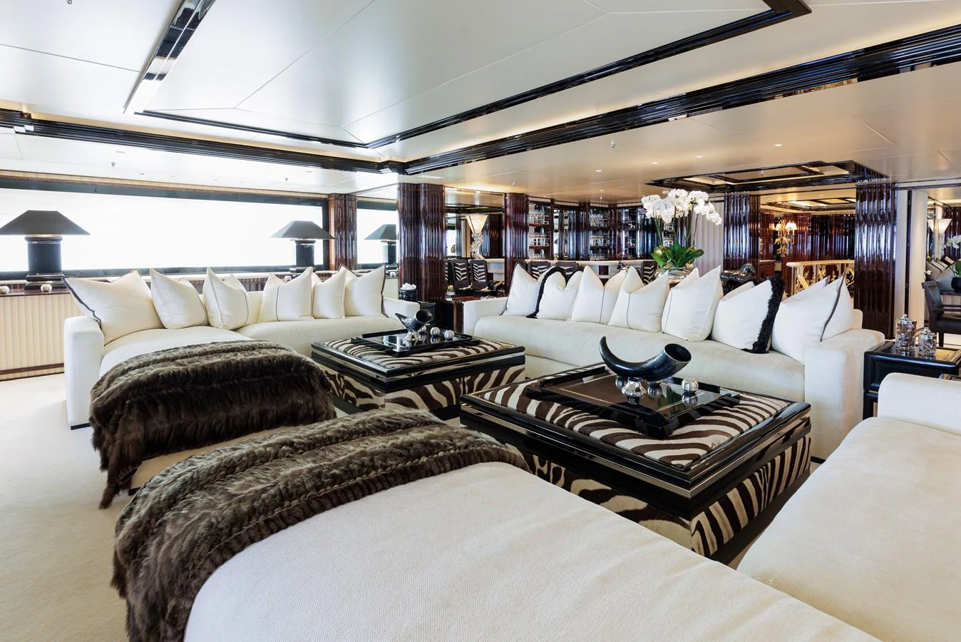 a large bedroom with a large bed aboard LIONESS V Yacht for Sale