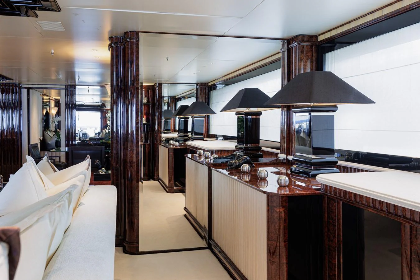 a room with a table and chairs aboard LIONESS V Yacht for Sale