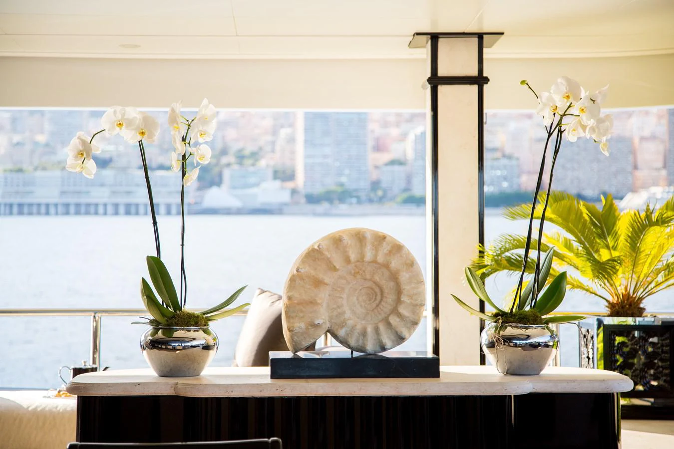 a window with a globe and flowers aboard LIONESS V Yacht for Sale