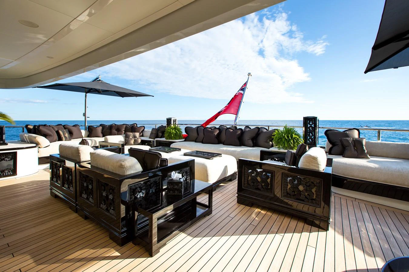 a living room with a large patio and a large body of water aboard LIONESS V Yacht for Sale