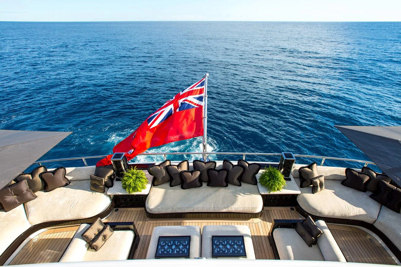 a boat with a flag on it aboard LIONESS V Yacht for Sale
