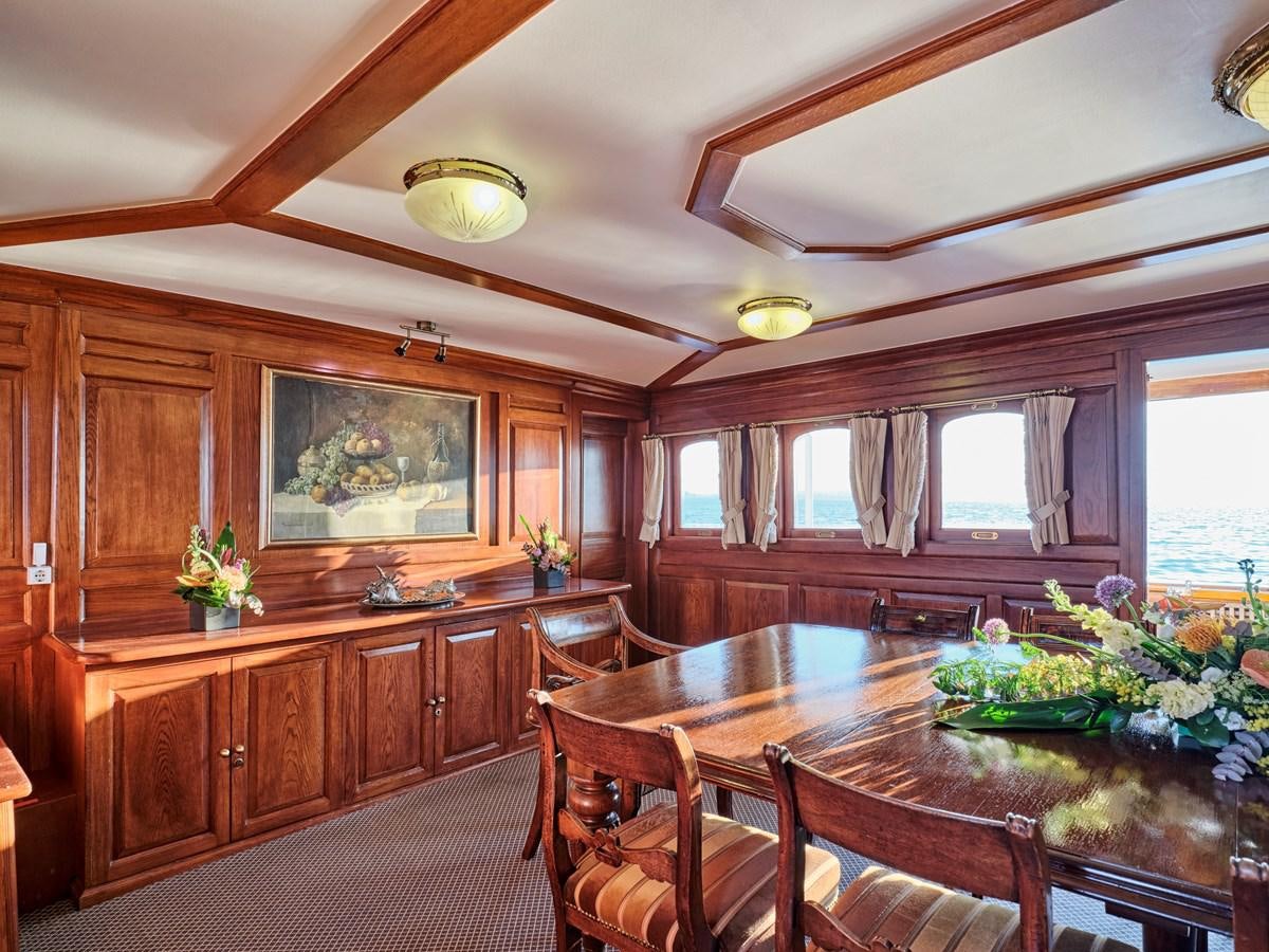 a large kitchen with wooden cabinets aboard MADIZ Yacht for Sale