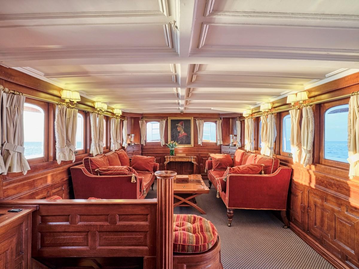 a large living room with a large window aboard MADIZ Yacht for Sale