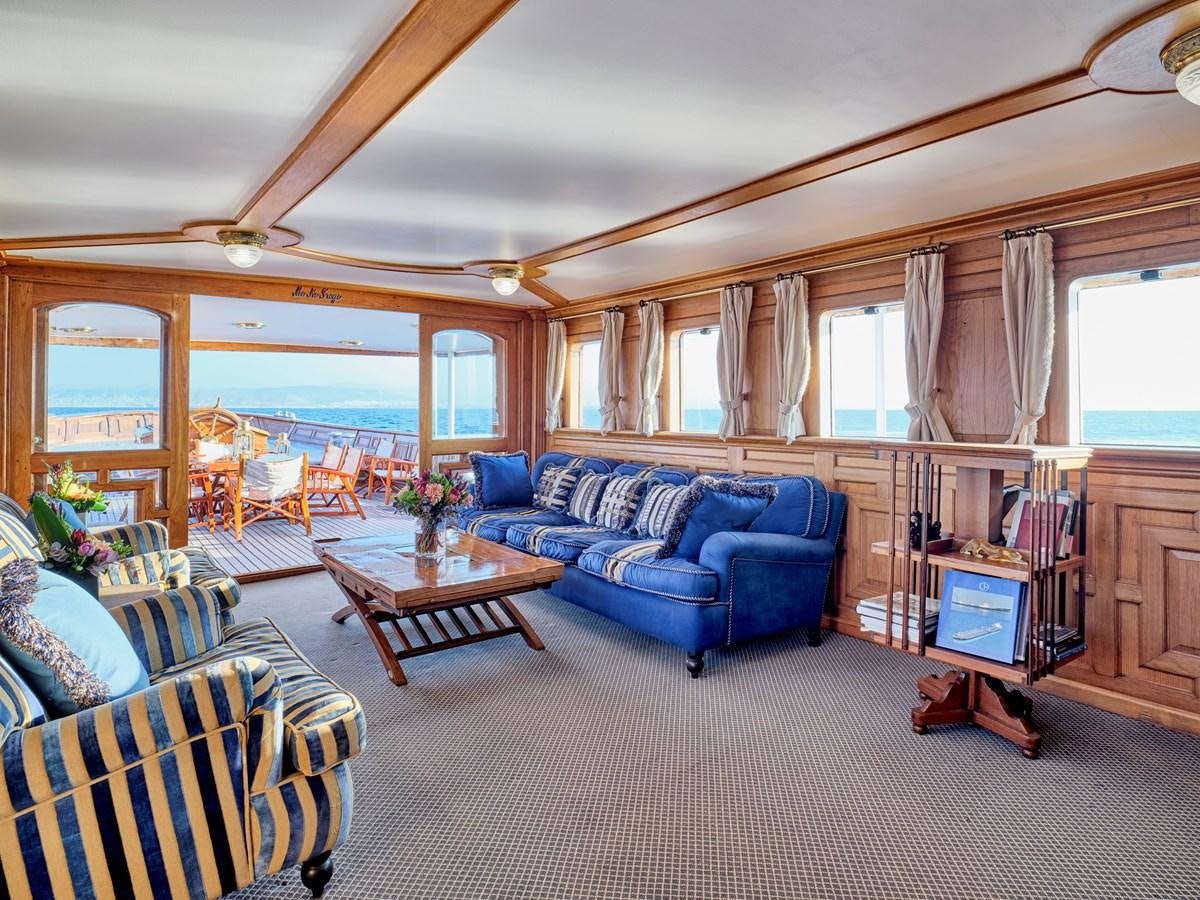 a living room with a couch and a tv aboard MADIZ Yacht for Sale