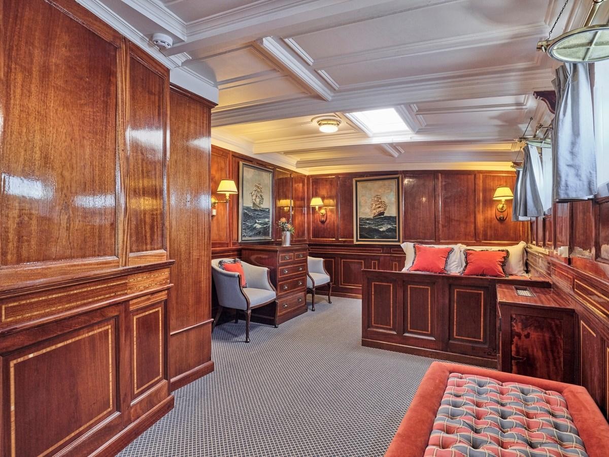 a large room with a bed and a desk aboard MADIZ Yacht for Sale