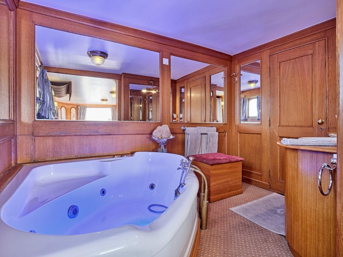 a bathroom with a tub aboard MADIZ Yacht for Sale