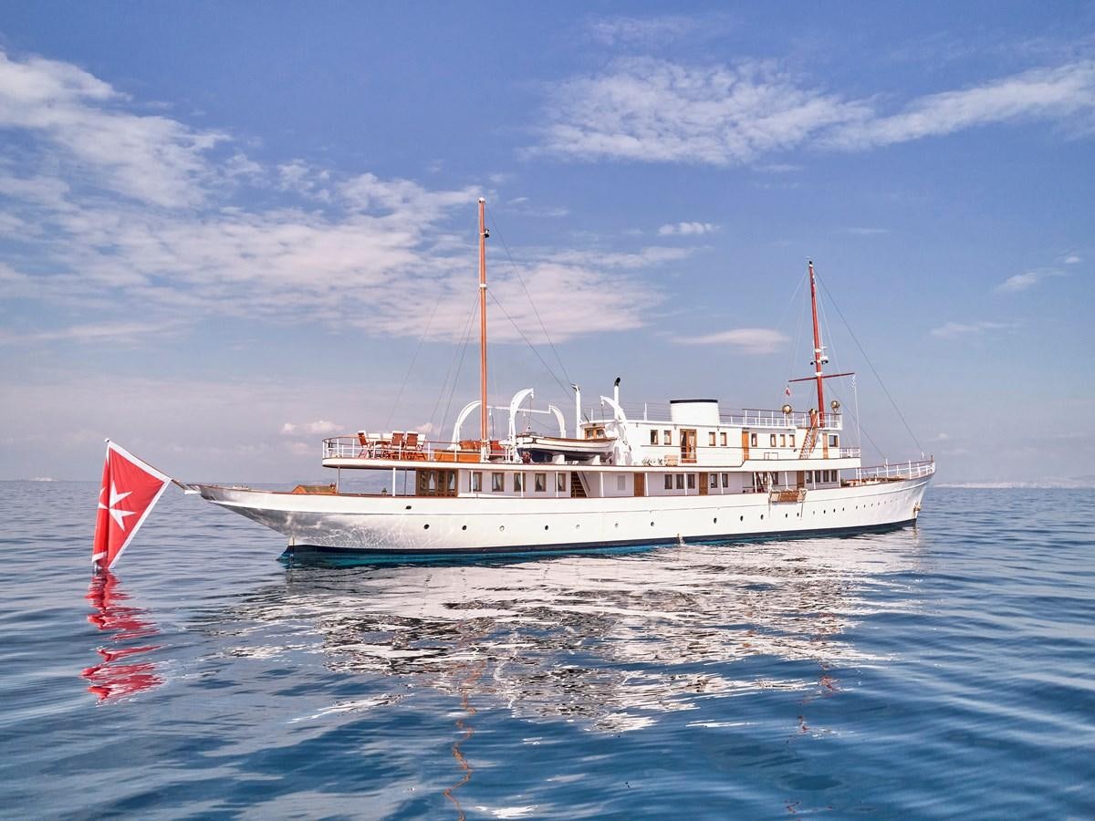 a large white boat in the water aboard MADIZ Yacht for Sale