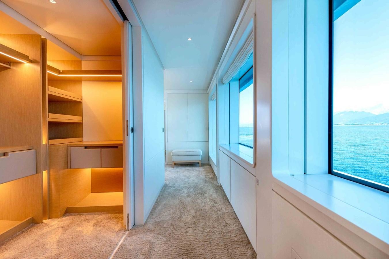 a hallway with white walls aboard MISS CANDY Yacht for Sale
