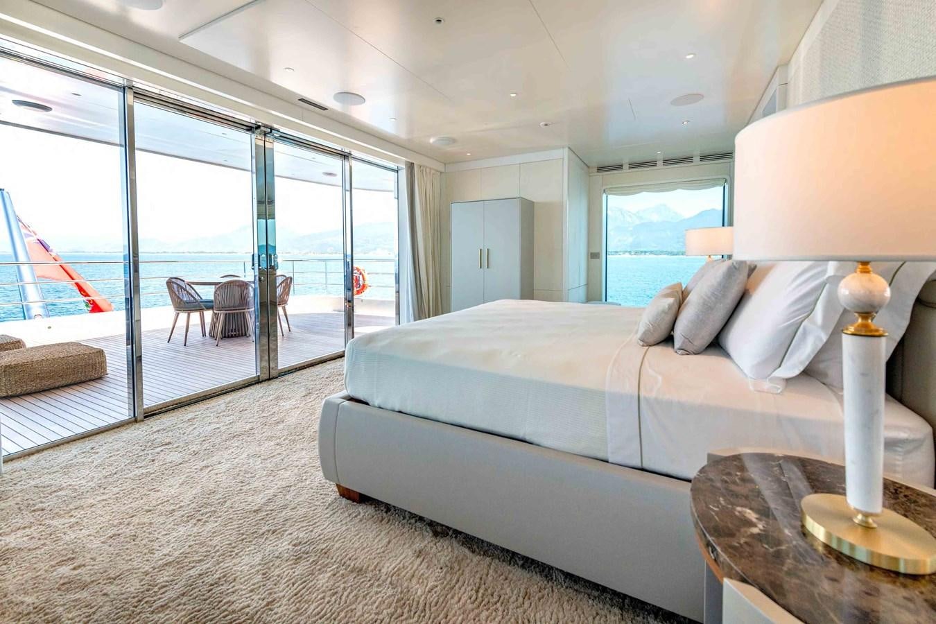 a bedroom with a large bed aboard MISS CANDY Yacht for Sale