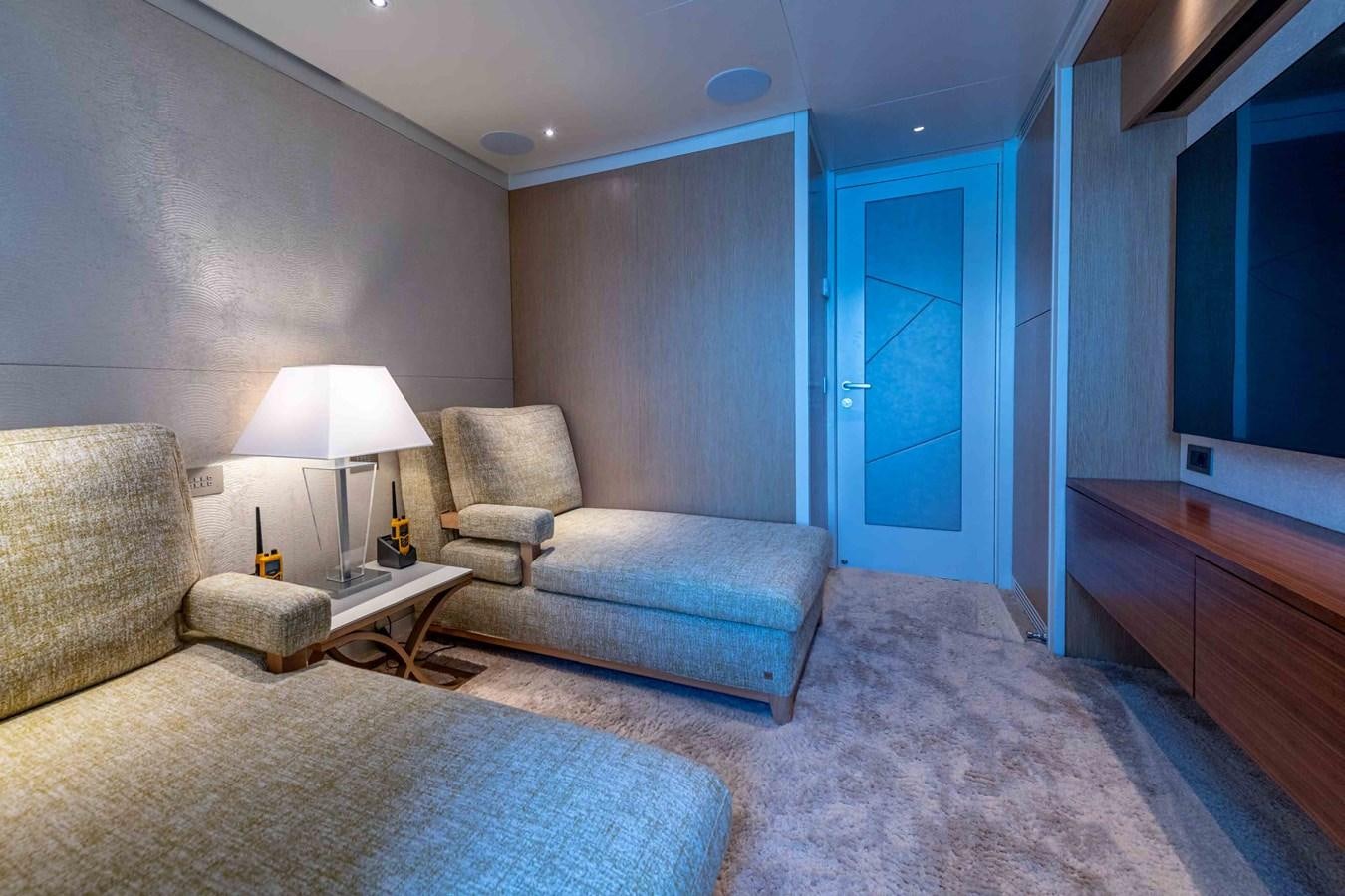 a living room with a couch and a lamp aboard MISS CANDY Yacht for Sale