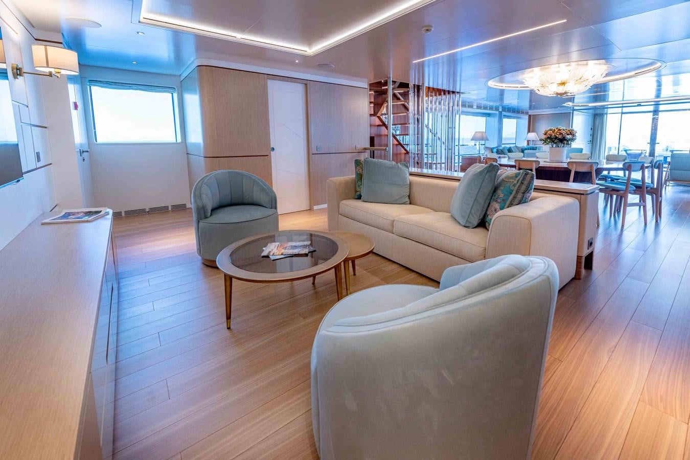 a living room with a couch and a coffee table aboard MISS CANDY Yacht for Sale