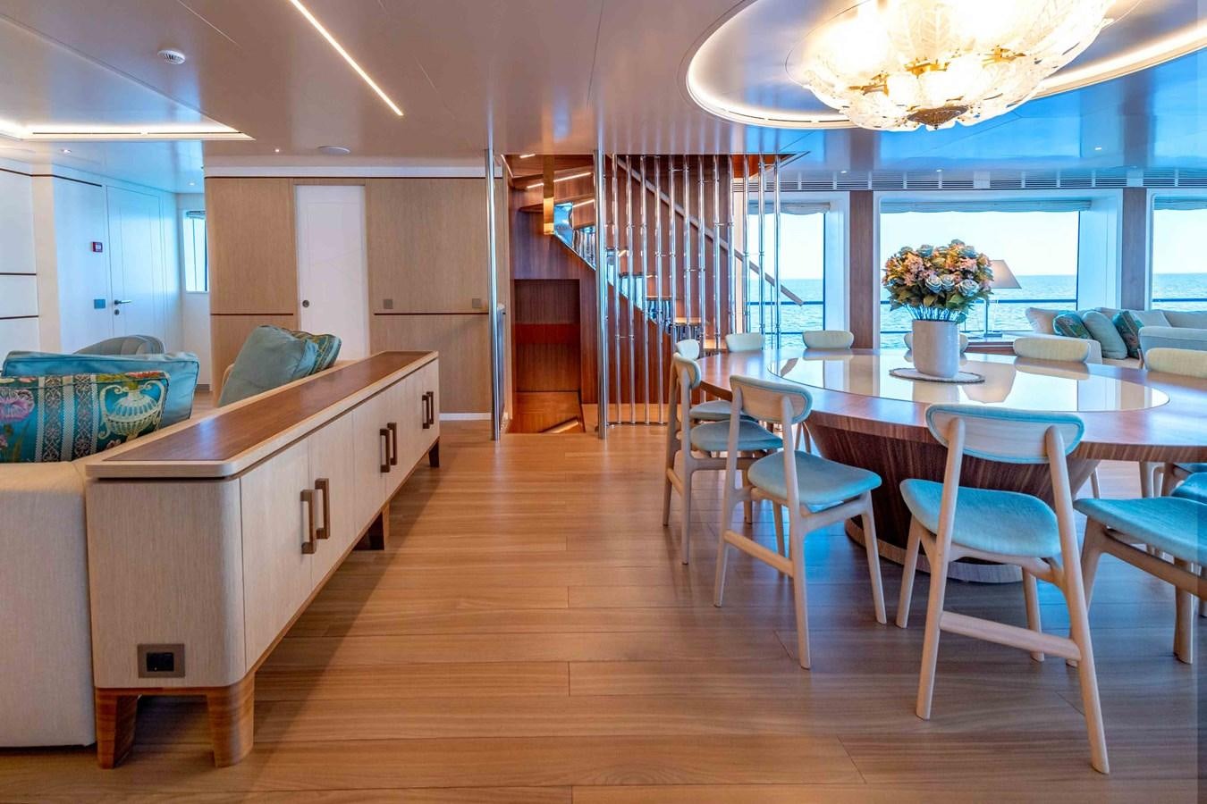 a large kitchen with a dining table aboard MISS CANDY Yacht for Sale