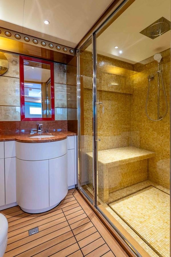 a bathroom with a glass shower aboard MISS CANDY Yacht for Sale