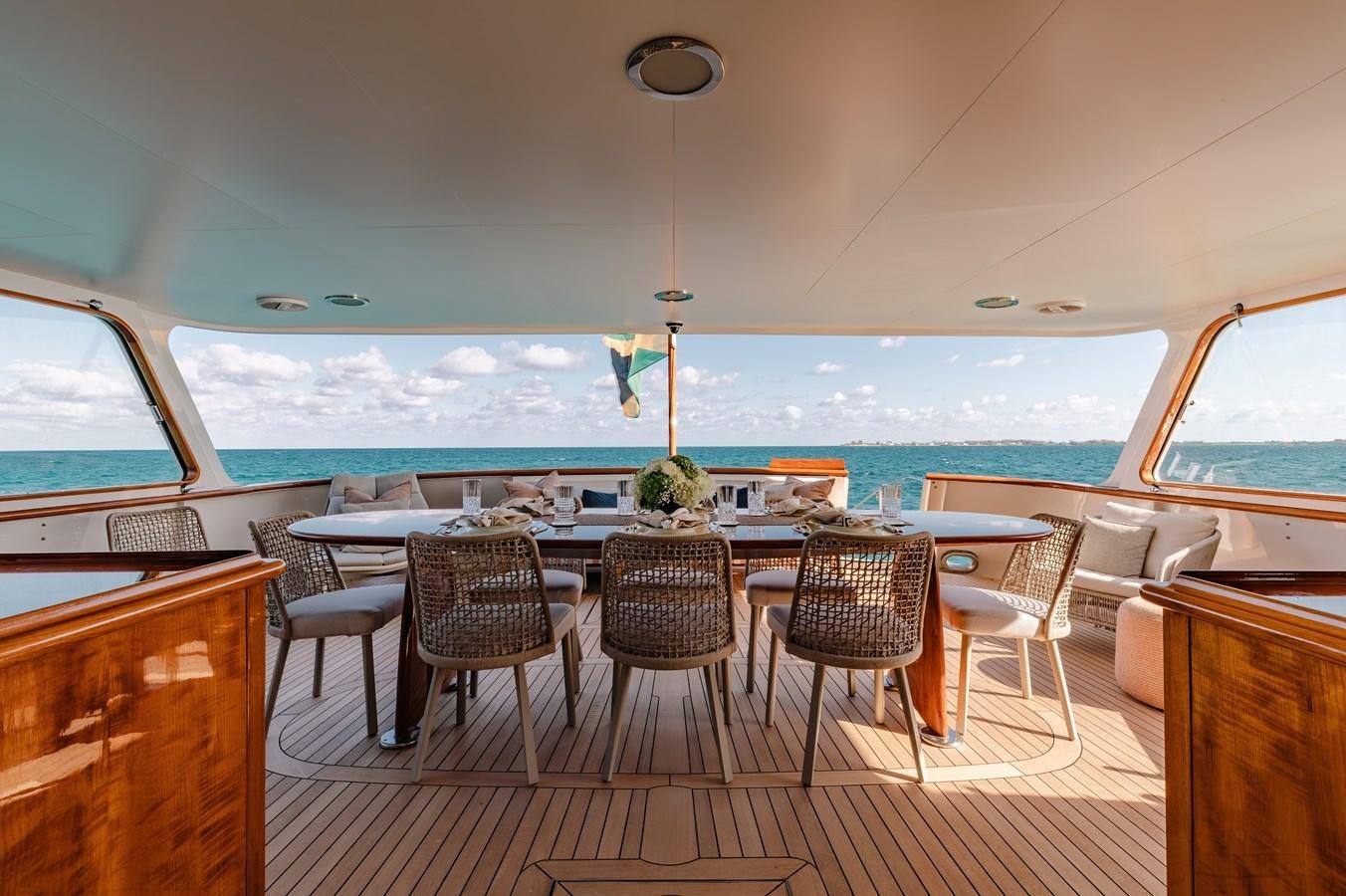 a boat with a table and chairs aboard CALYPSO Yacht for Sale
