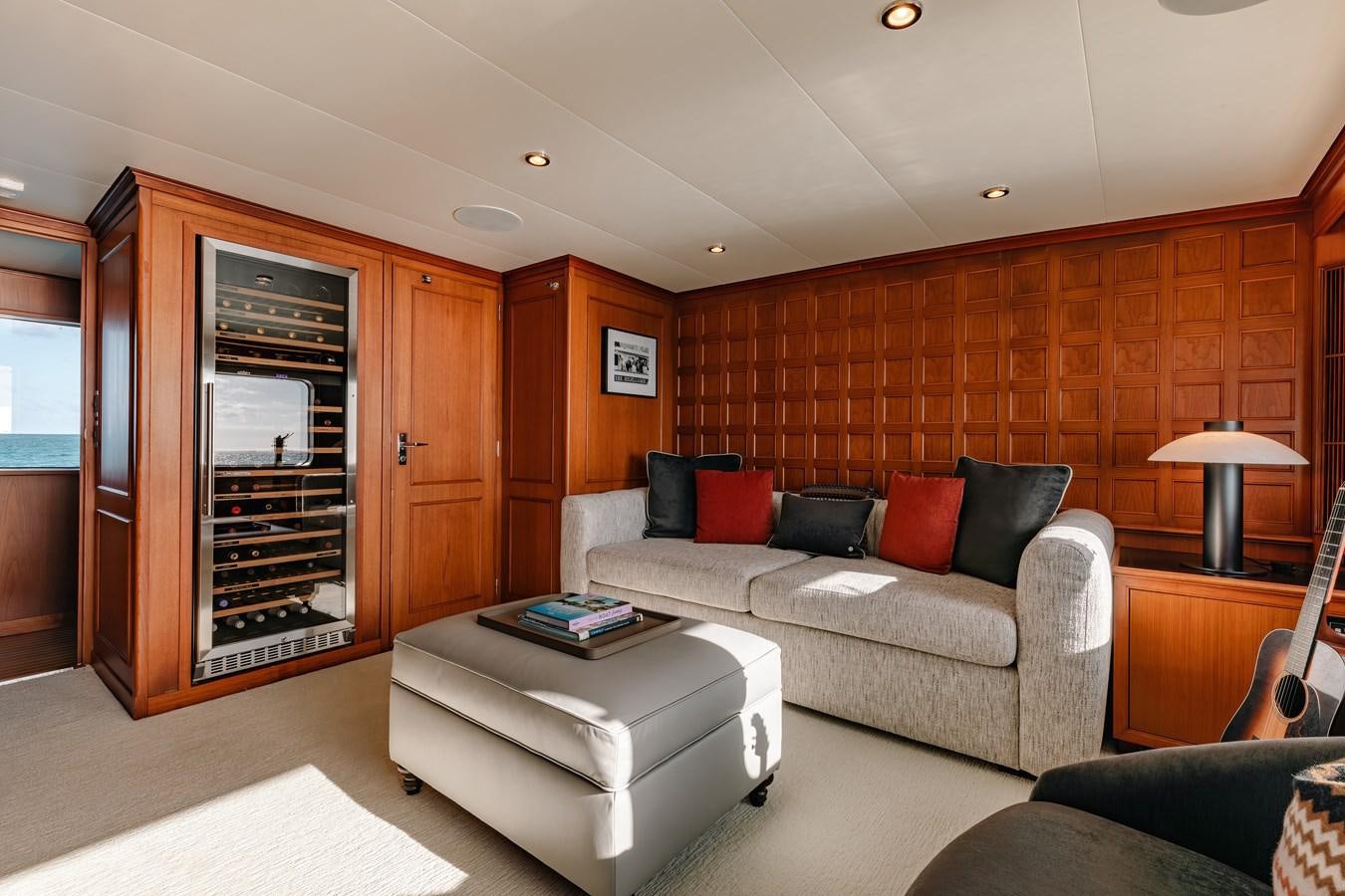 a living room with a couch and a coffee table aboard CALYPSO Yacht for Sale