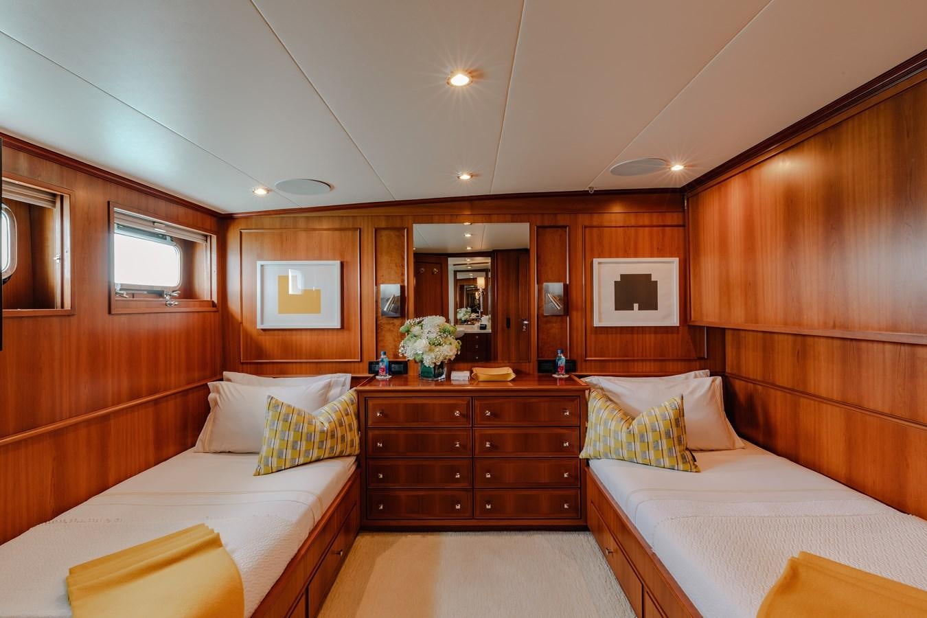 a room with a bed and a dresser aboard CALYPSO Yacht for Sale