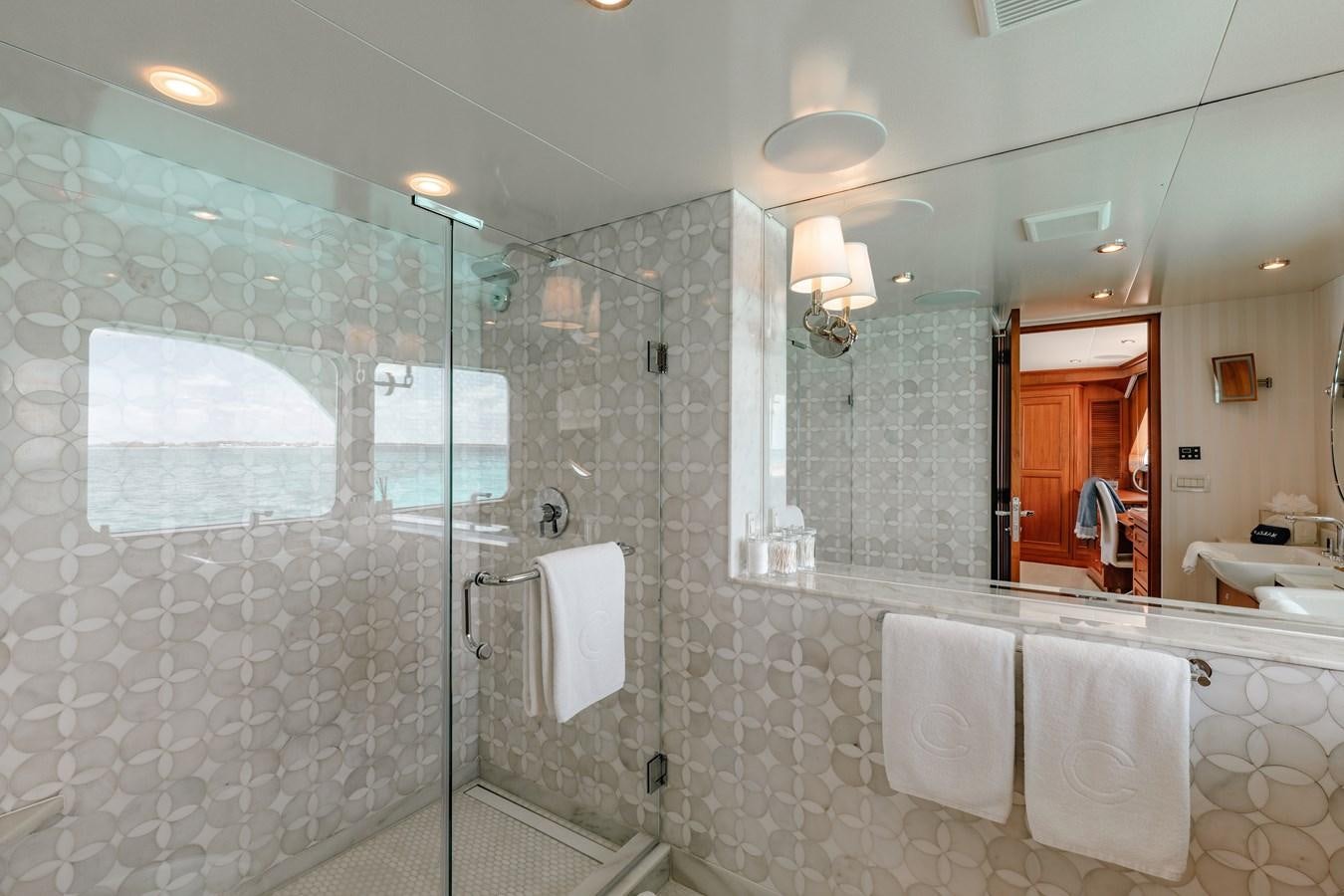 a bathroom with a glass shower aboard CALYPSO Yacht for Sale